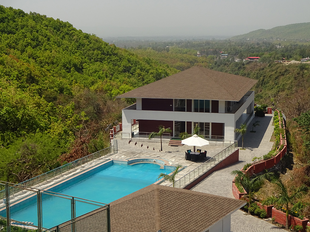 CSI pool and residential building in the green hills of Dehradun
